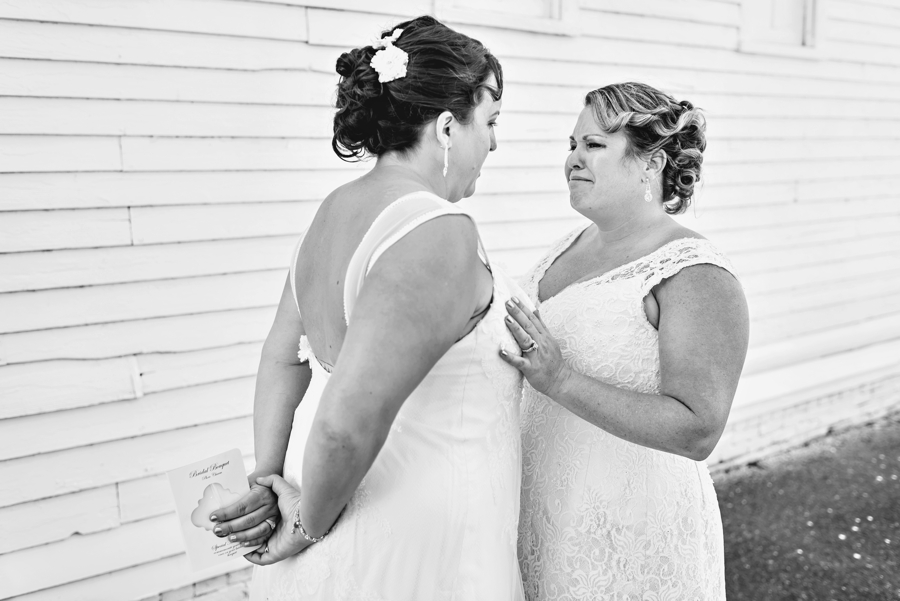An emotional bride crying after seeing her bride for the first time in her wedding dress.